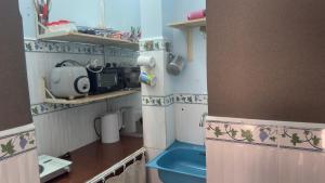 a small room with a pretend kitchen in a doll house at Lam NguyenVn Minihouse in Can Tho