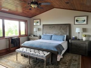 a bedroom with a large bed and a wooden ceiling at Hot Tub and Stunning Views Luxury Beech Mtn Escape! in Beech Mountain