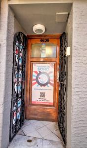a door to a store with a sign on it at Play Hostel Soho in Buenos Aires