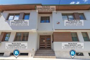 a building with different signs on the front of it at Mayisa Apartments in Sarajevo +86 photos