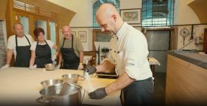 a group of people in a kitchen preparing food at Casa Bambina in Varenna