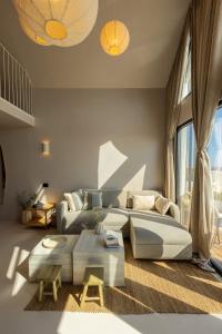 a living room with a couch and a table at Oasis Village Eforie Nord in Eforie Sud