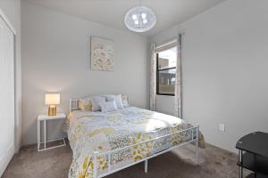 a bedroom with a bed and a window at Serene Retreat with Pool & Spa 3 Bed 3 Bath in Tucson +36 photos