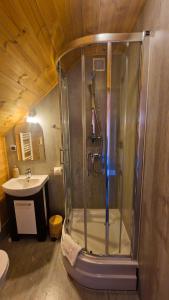 a bathroom with a shower and a sink at Karczma Rybna Rybaczówka Marina B&B in Świnoujście +57 photos