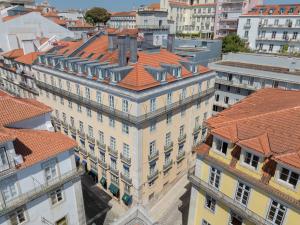 an overhead view of a building with orange roofs at Martinhal Lisbon Chiado in Lisbon
