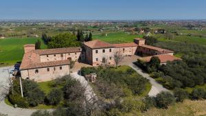 an aerial view of a large building in a field at Castello di Ribano Le Dimore in Savignano sul Rubicone