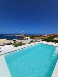 a swimming pool with a view of the ocean at CasaEole B&B in El Haouaria