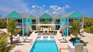 a villa on the beach with a swimming pool at The Turtle Nest at Cottages in Sand Bluff