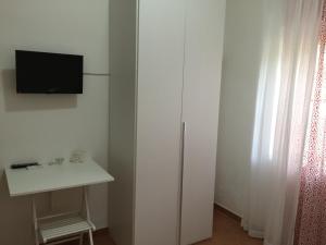 Uma TV ou centro de entretenimento em Villa Cenzina