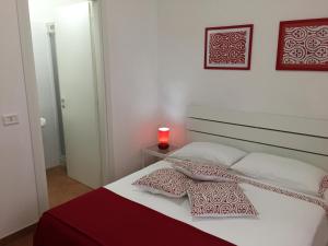 Cama ou camas em um quarto em Villa Cenzina