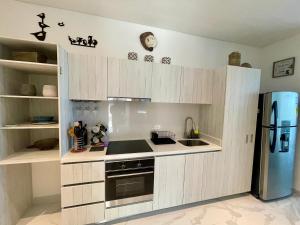 Η κουζίνα ή μικρή κουζίνα στο Apartamento de Playa 1013