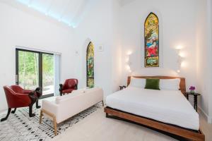 Ένα ή περισσότερα κρεβάτια σε δωμάτιο στο The Mastic Cottage Collection +90 φωτογραφίες