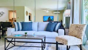 a living room with a couch and a table at Hideaway at Seagull #25 Condo in George Town +61 photos