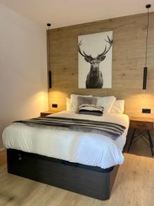 En eller flere senge i et værelse på Lodge Mountain Dornajo