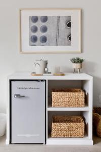 a white cabinet with a refrigerator in a room at Hotel Circulo - Park Circle - Suite 360 in Charleston +2 photos