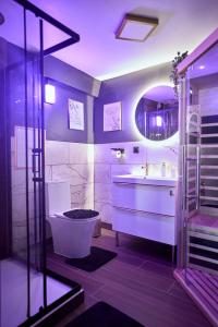 a bathroom with a toilet and a sink at Romance House in Arnouville-lès-Gonesse +20 photos