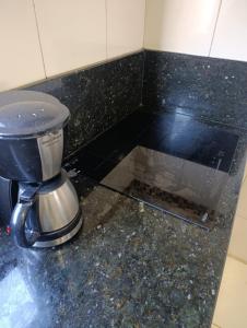 a coffee pot sitting on top of a counter at casa para Oktoberfest in Blumenau +10 photos