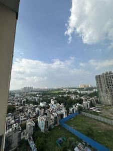 Nespecifikovaný výhled na destinaci Greater Noida nebo výhled na město při pohledu z apartmánu + 1 fotografie