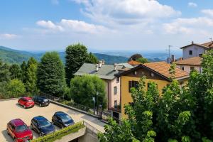 a group of cars parked in a parking lot at Appartamenti Monti Como Lake in Brunate