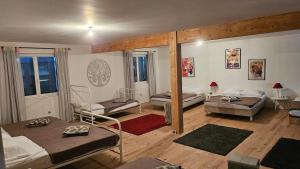 a room with two beds and a room with two beds at La Maison de Pierre in Manses