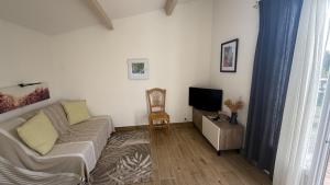 Μια τηλεόραση ή/και κέντρο ψυχαγωγίας στο Maison D'hôtes Hippône