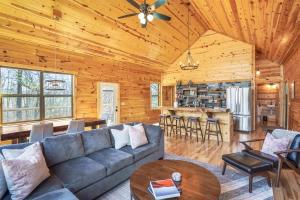 a living room with a couch and a table at Modern Luxury I Hot Tub I Hiking in McArthur