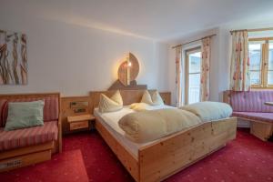 Postel nebo postele na pokoji v ubytování Hotel Garni Austria