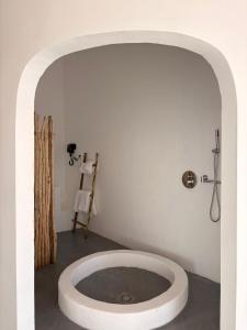 a bathroom with a bath tub in a room at Lalaland Retreat Phú Quý in Cù Lao Thu