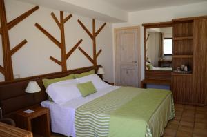 Postel nebo postele na pokoji v ubytování Artemisia Resort