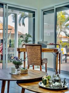 a room with a table with a laptop on it at Villa La Pintora in Playa de Santiago