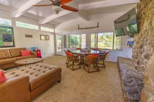 a living room with a couch and a table at Fairway Haven in Munds Park