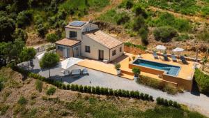 an aerial view of a house with a swimming pool at Villa Magliolo Panoramic Luxury Retreat in Cefalù