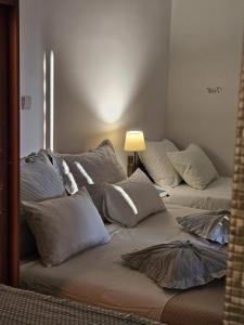 a room with two beds with pillows on it at Studio apartment Gorana with swimming pool in Jelsa +35 photos