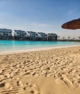 a view of the beach with condos in the background at 1 Bed Crystal Lagoon Escape in Pretoria