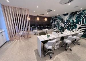 an office with a desk and chairs in a room at 1 Bed Crystal Lagoon Escape in Pretoria