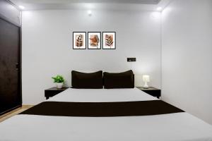 Postel nebo postele na pokoji v ubytování Hotel O Swarun and Banquet Hall + 22 fotografií