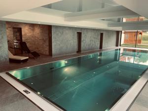 a large swimming pool in a building at Kurhotel Schluchsee Apartment 1305 in Schluchsee