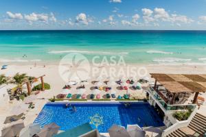 an aerial view of the beach and pool at casa paraiso at The Ocean Vibes Suites by Casa Paraiso in Cancún