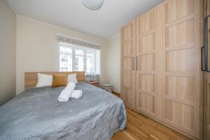 a bedroom with a bed with two white pillows at Free parking in the yard Quiet area City center in Tallinn