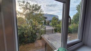an open window with a view of a street at Totteham stadium in London