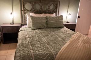 a bedroom with a large bed with two night stands at The Gentry House in Newburgh