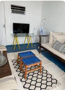 a living room with a couch and a table at centro Historico Salvador in Salvador