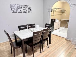 a dining room with a table and chairs at D'Aya Sofea Homestay Padang Besar in Padang Besar