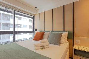 Apartamento novo em frente ao Allianz Parque com 1 vagaにあるベッド