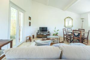 a living room with a couch and a table at Le Chopin - Aix in Aix-en-Provence +14 photos