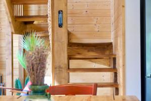 a room with a table with a plant on a table at Hanguloft - The cozy cabin by the lake in Hangul +60 photos