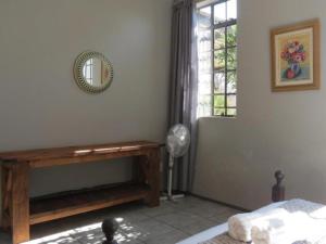 Ένα ή περισσότερα κρεβάτια σε δωμάτιο στο Hekpoort Rorymi Guest farm