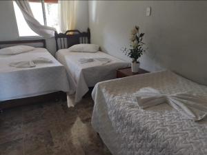 Postel nebo postele na pokoji v ubytování Villa Rosita