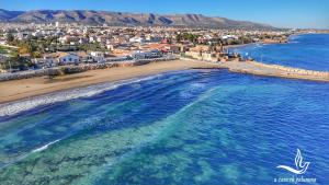 an aerial view of a beach and the ocean at a casa rà Palumma Rooms in Avola