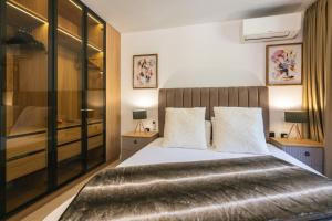 Ένα ή περισσότερα κρεβάτια σε δωμάτιο στο Einik Luxury Apartments +24 φωτογραφίες